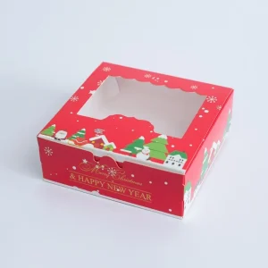 Cutie Crăciun roșie cu fereastră – sat de iarnă 14×14×5 cm din carton gros, decor elegant și cadou ideal pentru sărbători.